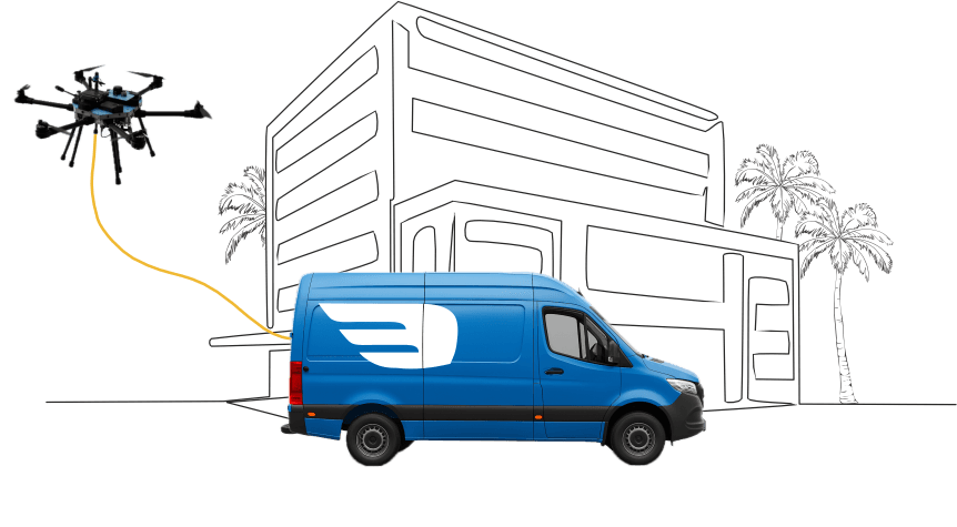 Skyborn Drone Wash van with the city in the background and a drone flying out of the van